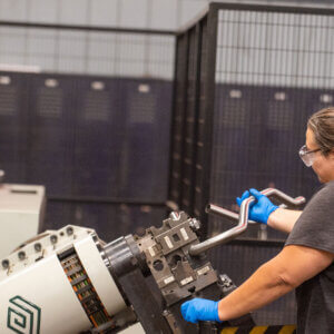 Leonhardt Manufacturing employee using Tube Bender to create complex bends